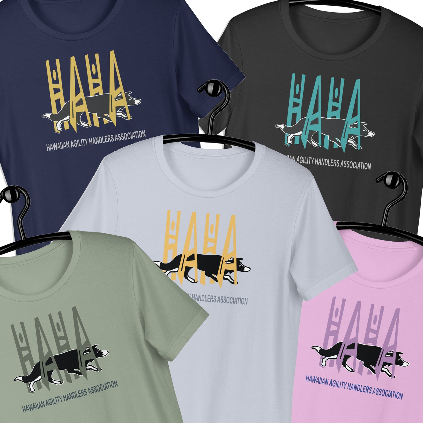 Six short-sleeve graphic T-shirts on hangers, shown in navy, charcoal, light blue, sage green, and light pink. Each shirt features a large stylized 'HAHA' text in a different color above a black-and-white dog silhouette and the text HAWAIIAN AGILITY HANDLERS ASSOCIATION'.